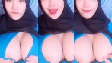 Bokep Jilbab Pamer Dada Montok Tanpa BH Sange poster